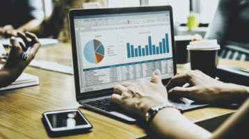 a laptop screen showing graphs and charts